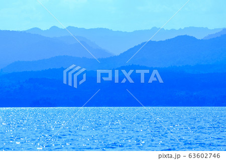 Blue light reflected from the water surface of the Blue light reflected from the water surface of the 63602746