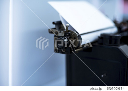 Old vintage typewriter with a blank sheet of paper Old vintage typewriter with a blank sheet of paper 63602954