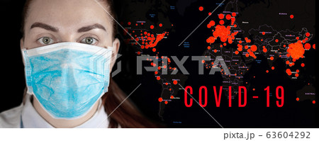 Map show where the coronavirus has spread. Young girl in a medical mask on a dark background. Coronavirus epidemic, word COVID-19 on global map. 63604292