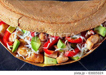 Savory pancake stuffed with avocado and chicken Savory pancake stuffed with avocado and chicken 63605024