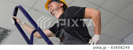 Workman having backache at job Workman having backache at job 63608249