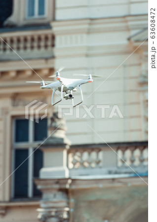 small quad copter in the sky 63608472