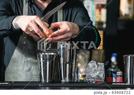 bartender making relaxing coctail on a bar bartender making relaxing coctail on a bar 63608722