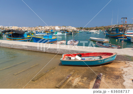 Fishing boat lay on a coast in Marsaxlokk town, Fishing boat lay on a coast in Marsaxlokk town, 63608737