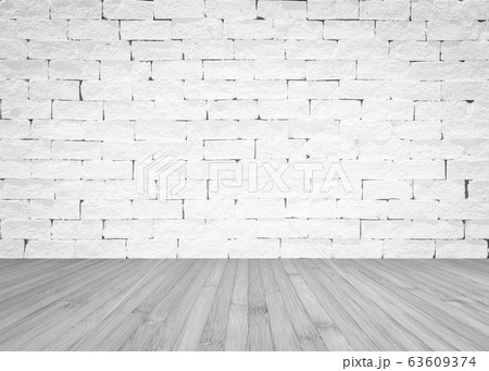 Grunge old aged brick wall painted in white color with wooden floor textured background in light grey 63609374