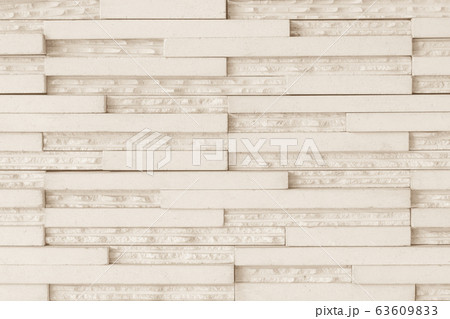 Granite tiled wall detailed pattern texture background in natural light creme beige color 63609833