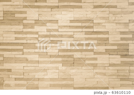Brick tile wall pattern background in light yellow gold brown color 63610110