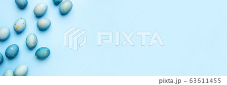 Easter frame of eggs painted in blue color. Easter frame of eggs painted in blue color. 63611455