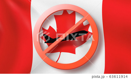 Warning sign with crossed out plane on the background of Canadian flag. 63611914