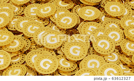 Gの文字 ゴールドの頭文字 が刻印されたたくさんの金貨の写真素材