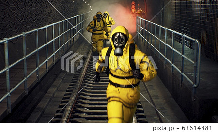 People in chemical protective clothing run out of the tunnel to go to fight the epidemic. The concept of a post-apocalyptic world after a global pandemic. 3D Rendering People in chemical protective clothing run out of the tunnel to go to fight the epidemic. The concept of a post-apocalyptic world after a global pandemic. 3D Rendering 63614881