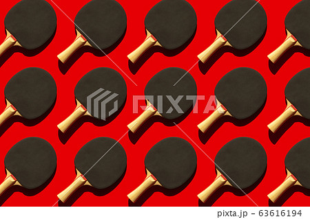 Red background with repeating tennis rackets Red background with repeating tennis rackets 63616194