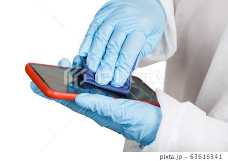 Hands in protective gloves cleaning phone from 63616341