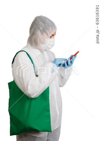 Woman in anti-epidemic suit going to shoping with 63616391