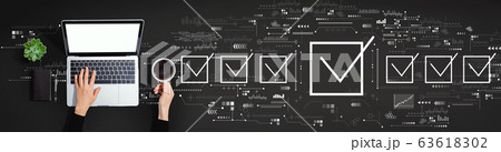 Checklist concept with person using laptop computer 63618302