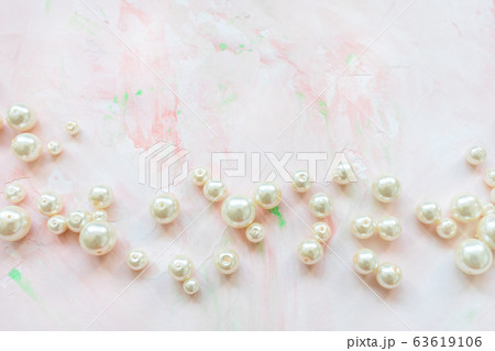 White pearls on pink. Creative abstract background 63619106