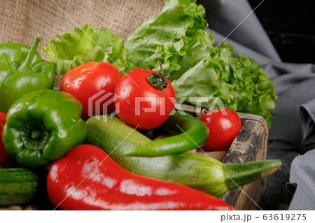 Red and green peppers with tomato and lettuce. Red and green peppers with tomato and lettuce. 63619275