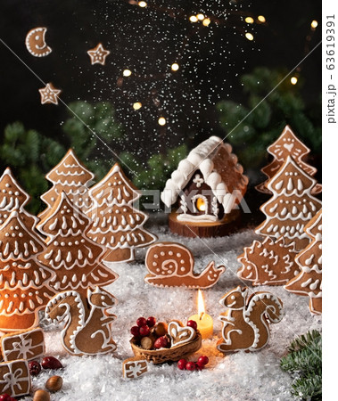 Christmas gingerbread cookies in the form of squirrels and trees 63619391