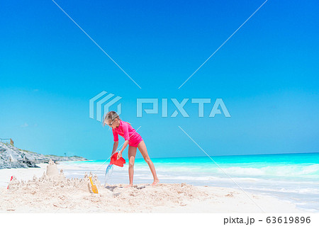 Portrait of adorable little girl at beach during summer vacation