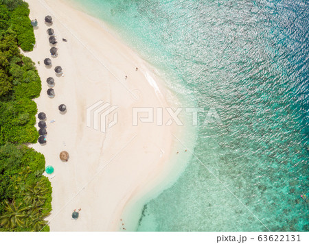 Aerial drone view of picture perfect beach and turquoise lagoon on small tropical island on Maldives Aerial drone view of picture perfect beach and turquoise lagoon on small tropical island on Maldives 63622131