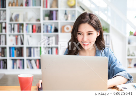 student using laptop at home 63625641