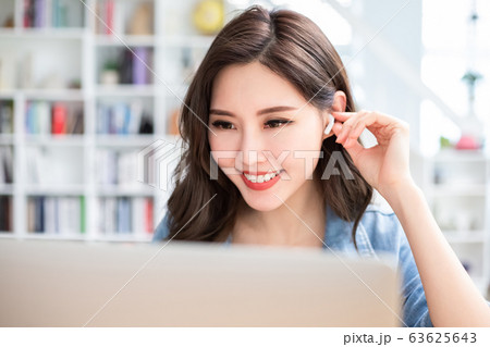 student using laptop at home 63625643