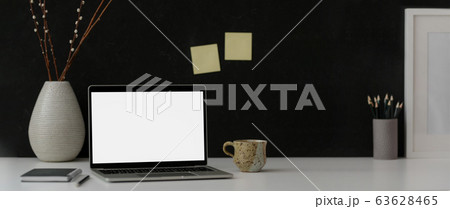 Cropped shot of dark modern workspace with mock-up 63628465