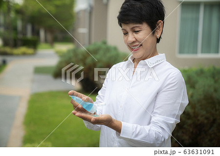 Old people in asia usd alcohol gel cleaning her 63631091