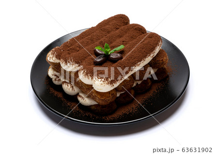 Classic tiramisu dessert on ceramic plate isolated on white background with clipping path Classic tiramisu dessert on ceramic plate isolated on white background with clipping path 63631902