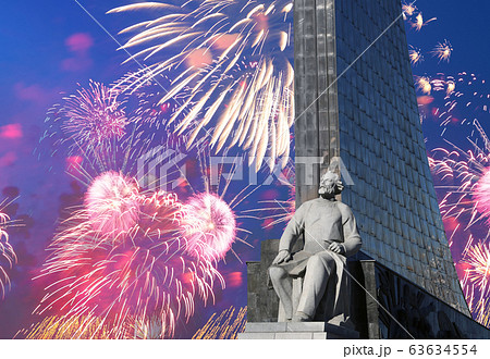 A statue of Konstantin Tsiolkovsky and Conquerors of Space Monument and fireworks, Moscow, Russia A statue of Konstantin Tsiolkovsky and Conquerors of Space Monument and fireworks, Moscow, Russia 63634554