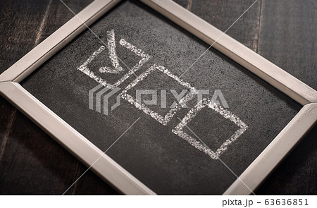 Blackboard with check boxes on chalk board. Hand Blackboard with check boxes on chalk board. Hand 63636851