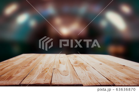 Wooden surface on blurry background with spots. Wooden surface on blurry background with spots. 63636870