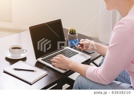Senior woman buying goods in internet at home, close up Senior woman buying goods in internet at home, close up 63638210