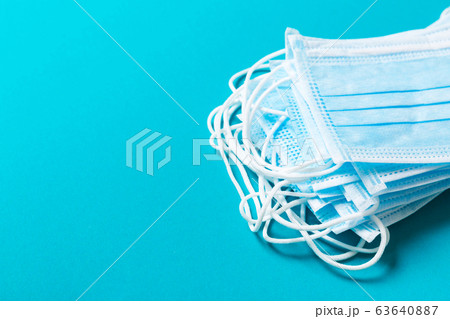 Top view of protective medical masks on blue 63640887