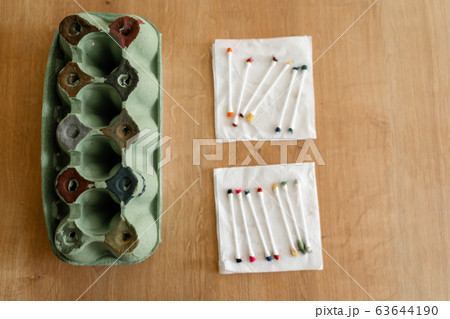 Easy toddler craft toy made from cartoon egg tray. Colors sorter child activity 63644190