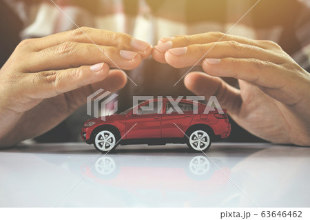 Male hands and car as protection of car insurance Male hands and car as protection of car insurance 63646462