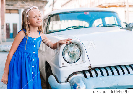 Tourist girl in popular area in Havana, Cuba. Young kid traveler smiling 63646495