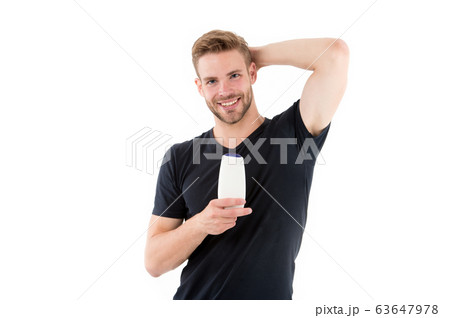 Happy man hold shampoo bottle isolated on white. Happy man hold shampoo bottle isolated on white. 63647978