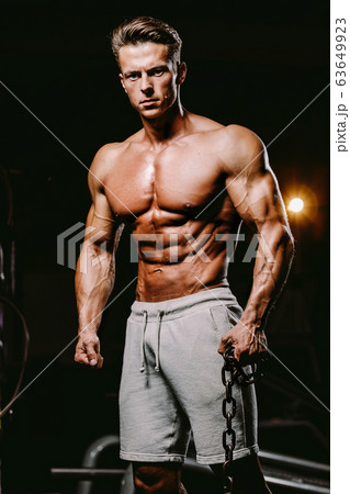 muscular attractive man in gym 63649923