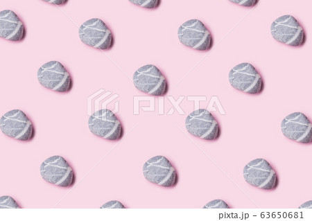 Sea pebble pattern on pastel pink background 63650681