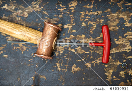 hammer and screwdriver on desk at repair shops 63650952