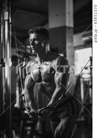 muscular bodybuilder guy workout in gym muscular bodybuilder guy workout in gym 63651370