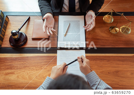 Lawyer working with client discussing contract Lawyer working with client discussing contract 63659270