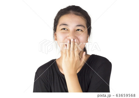 Asian woman bring one hand to cover the mouth and emotion laugh Asian woman bring one hand to cover the mouth and emotion laugh 63659568