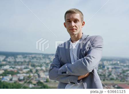 portrait of young handsome serious businessman on city background portrait of young handsome serious businessman on city background 63661125
