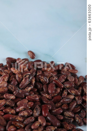 Red beans seeds stock over blue marble 63663000
