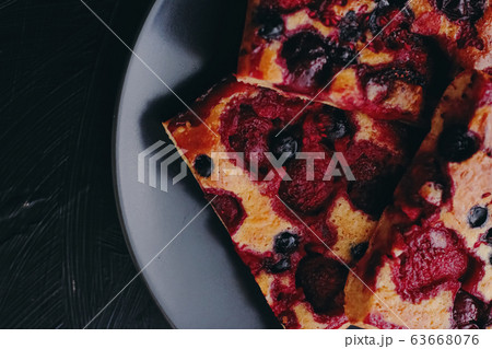 Berry pie on black plate, rustic homemade food with organic ingredients 63668076