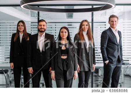 Confident team. Successful colleagues posing at camera 63668086