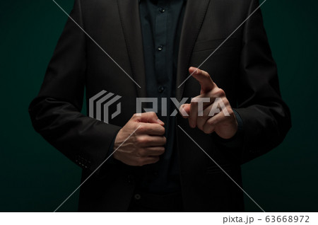 Man's hand clicks on an invisible touchpad 63668972