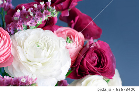 Pink, white and fuchsia flowers on a grey 63673400